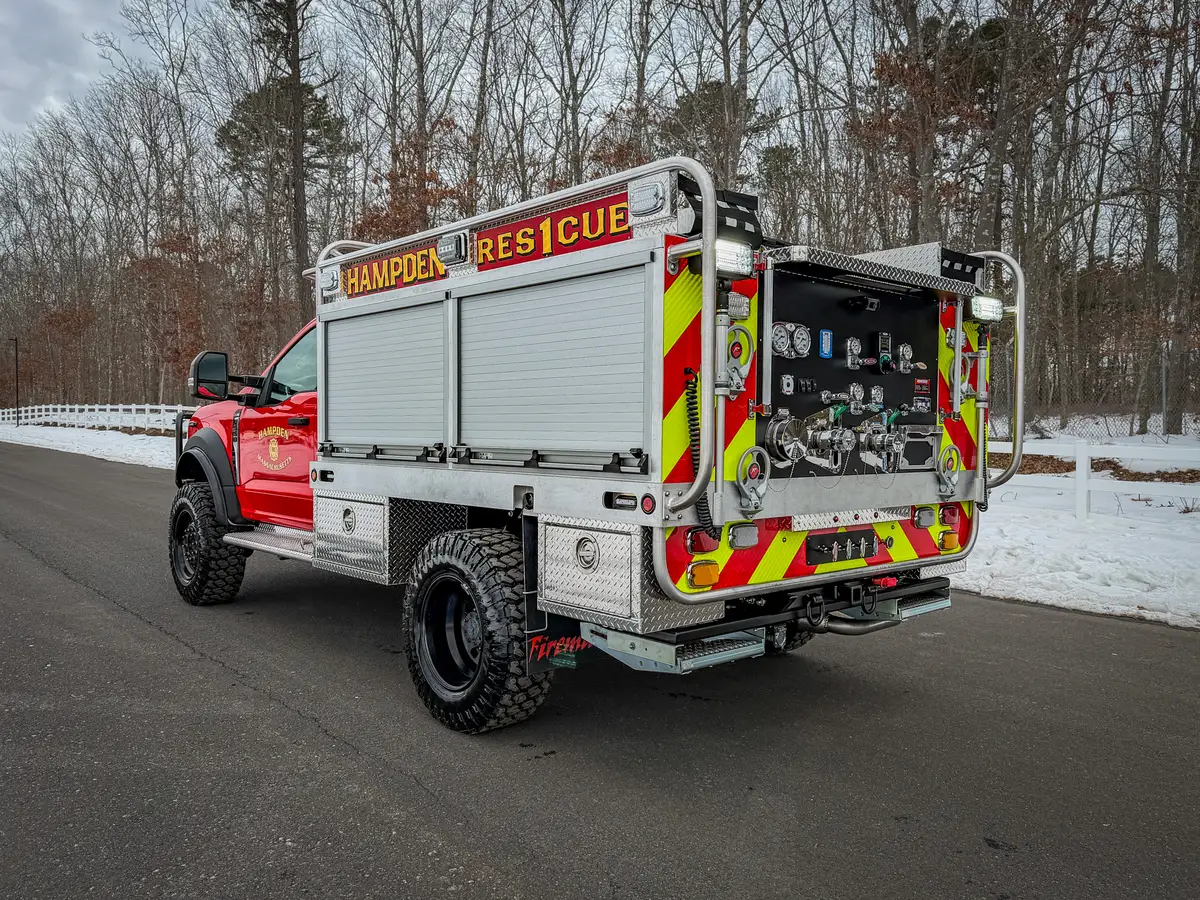 Rear driver-side angle with chevron panel and rear pump area.